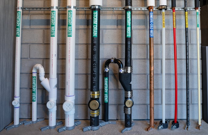 Interconnected pipes showcasing advanced commercial plumbing solutions in a large-scale installation